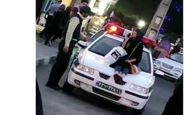 ماجرای دختر بدحجابی که  روی کاپوت خودروی نیروی انتظامی نشست